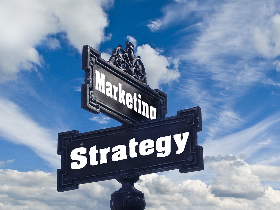 Image contains two road signs that say "email marketing strategy".