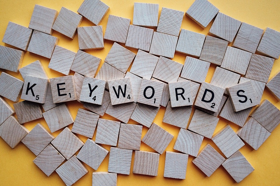 Image contains scrabble letters that spell out "keywords".